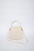 White woven handbag on a light gray background